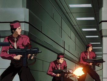 Movie still from “Gundam Wing: The Movie - Endless Waltz” (1998), directed by Yasunao Aoki – A group of men in red shirts are holding guns; Wide shot, Low angle