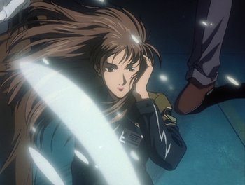 Movie still from “Gundam Wing: The Movie - Endless Waltz” (1998), directed by Yasunao Aoki – A woman with long brown hair is in the water; Close Up shot, Overhead angle
