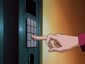 Movie still from “Gundam Wing: The Movie - Endless Waltz” (1998), directed by Yasunao Aoki – A hand pressing a button on an electronic device; Extreme Close Up shot, Overhead angle