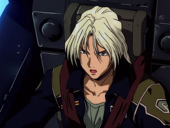 Movie still from “Gundam Wing: The Movie - Endless Waltz” (1998), directed by Yasunao Aoki – A man with blonde hair is sitting in a chair; Close Up shot, High angle