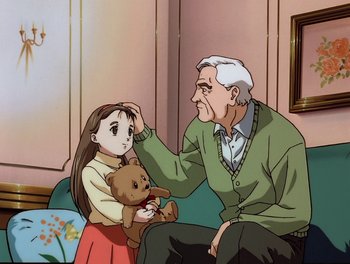 Movie still from “Gundam Wing: The Movie - Endless Waltz” (1998), directed by Yasunao Aoki – An old man holding a teddy bear and a little girl; Medium shot, High angle