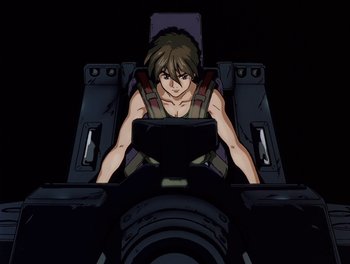 Movie still from “Gundam Wing: The Movie - Endless Waltz” (1998), directed by Yasunao Aoki – An animated character is sitting in a chair; Medium shot, Low angle