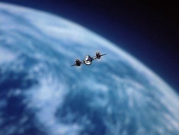Movie still from “Gundam Wing: The Movie - Endless Waltz” (1998), directed by Yasunao Aoki – A view of the earth from a space station; Extreme Wide shot, Overhead angle