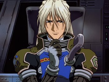 Movie still from “Gundam Wing: The Movie - Endless Waltz” (1998), directed by Yasunao Aoki – A man with blonde hair sitting in a chair; Close Up shot, High angle