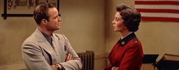 Movie still from “Guys and Dolls” (1955), directed by Joseph L. Mankiewicz – A man and a woman talking to each other; Medium shot, Over the shoulder angle