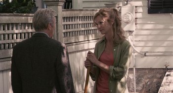 Movie still from “Hachi: A Dog's Tale” (2009), directed by Lasse Hallström – A man and a woman standing next to each other; Medium shot, Over the shoulder angle