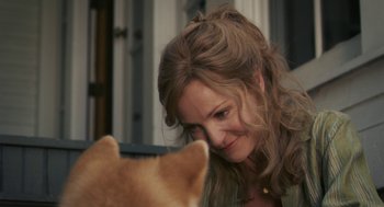 Movie still from “Hachi: A Dog's Tale” (2009), directed by Lasse Hallström – A person with a dog; Close Up shot, Over the shoulder angle