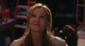 Movie still from “Hachi: A Dog's Tale” (2009), directed by Lasse Hallström – A person with long blonde hair; Close Up shot, Over the shoulder angle