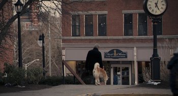 Movie still from “Hachi: A Dog's Tale” (2009), directed by Lasse Hallström – A man and a dog walking down the sidewalk; Extreme Wide shot, Over the shoulder angle