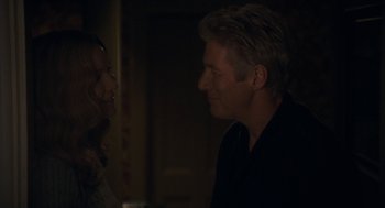 Movie still from “Hachi: A Dog's Tale” (2009), directed by Lasse Hallström – A man and a woman talking to each other; Close Up shot, Over the shoulder angle