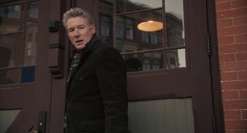 Movie still from “Hachi: A Dog's Tale” (2009), directed by Lasse Hallström – A man standing in front of a window; Medium shot, Low angle