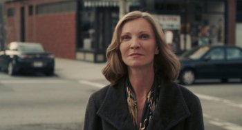 Movie still from “Hachi: A Dog's Tale” (2009), directed by Lasse Hallström – A person wearing a coat; Close Up shot, Over the shoulder angle