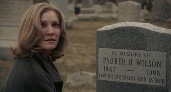 Movie still from “Hachi: A Dog's Tale” (2009), directed by Lasse Hallström – A woman standing in front of a grave in a cemetery; Close Up shot, Over the shoulder angle