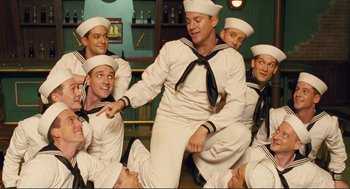 Movie still from “Hail, Caesar!” (2016), directed by Ethan Coen – A group of men dressed in sailor outfits; Medium shot, High angle