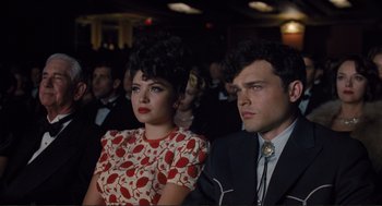 Movie still from “Hail, Caesar!” (2016), directed by Ethan Coen – A man and a woman sitting next to each other; Medium shot, Low angle