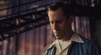 Movie still from “Hail, Caesar!” (2016), directed by Ethan Coen – A person with his eyes closed; Close Up shot, Low angle