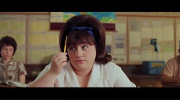 Movie still from “Hairspray” (2007), directed by Adam Shankman – A woman in a white shirt is talking on a phone; Close Up shot, Over the shoulder angle