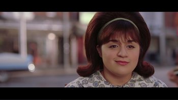 Movie still from “Hairspray” (2007), directed by Adam Shankman – A young woman with brown hair wearing a headband; Close Up shot, Over the shoulder angle