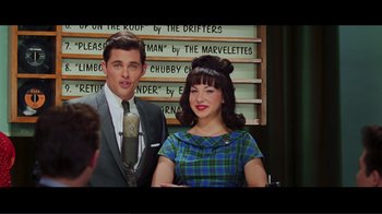Movie still from “Hairspray” (2007), directed by Adam Shankman – A man and a woman are standing next to each other; Medium shot, Over the shoulder angle