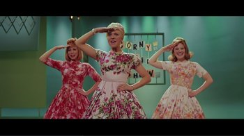 Movie still from “Hairspray” (2007), directed by Adam Shankman – A group of women in floral dresses standing next to each other; Medium shot, Low angle