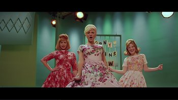 Movie still from “Hairspray” (2007), directed by Adam Shankman – A group of women standing next to each other on a stage; Wide shot, Low angle