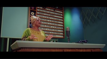 Movie still from “Hairspray” (2007), directed by Adam Shankman – An older woman is singing in front of a microphone; Medium shot, Low angle