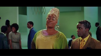 Movie still from “Hairspray” (2007), directed by Adam Shankman – A woman in a yellow and green dress with a hat on her head; Medium shot, Low angle