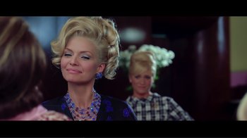 Movie still from “Hairspray” (2007), directed by Adam Shankman – Two women with long blonde hair and blue eyes; Medium shot, Over the shoulder angle