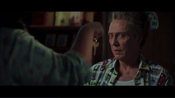 Movie still from “Hairspray” (2007), directed by Adam Shankman – An older woman looking at the camera in a room; Close Up shot, Over the shoulder angle