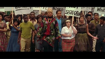 Movie still from “Hairspray” (2007), directed by Adam Shankman – A group of people are standing in front of a crowd; Medium shot, High angle