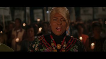 Movie still from “Hairspray” (2007), directed by Adam Shankman – A woman with blonde hair wearing a black and red dress; Close Up shot, High angle