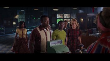 Movie still from “Hairspray” (2007), directed by Adam Shankman – A group of people standing in a room; Medium shot, Over the shoulder angle