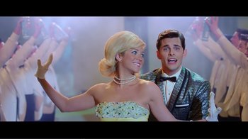 Movie still from “Hairspray” (2007), directed by Adam Shankman – A man and a woman dressed up as a couple; Medium shot, Low angle