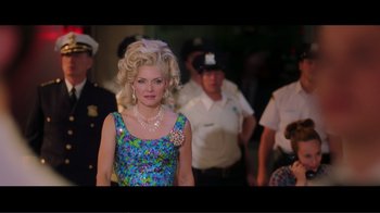 Movie still from “Hairspray” (2007), directed by Adam Shankman – A woman in a blue dress and a pearl necklace; Medium shot, Over the shoulder angle