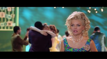 Movie still from “Hairspray” (2007), directed by Adam Shankman – A woman in a blue dress is looking at a man in a blue dress; Medium shot, Over the shoulder angle