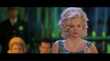 Movie still from “Hairspray” (2007), directed by Adam Shankman – A woman with blonde curly hair wearing a dress; Close Up shot, Over the shoulder angle