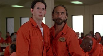 Movie still from “Half Baked” (1998), directed by Tamra Davis – A couple of men standing next to each other; Medium shot, Low angle