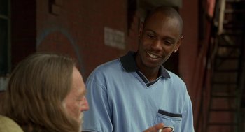 Movie still from “Half Baked” (1998), directed by Tamra Davis – A man in blue shirt talking to another man in blue shirt; Close Up shot, Over the shoulder angle