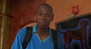 Movie still from “Half Baked” (1998), directed by Tamra Davis – A person wearing a blue shirt; Close Up shot, Low angle