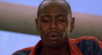 Movie still from “Half Baked” (1998), directed by Tamra Davis – A person with his eyes closed; Close Up shot, Overhead angle