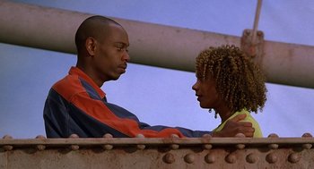 Movie still from “Half Baked” (1998), directed by Tamra Davis – A man and a woman are looking at each other; Close Up shot, Low angle