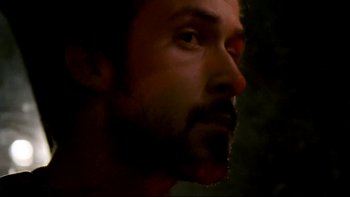 Movie still from “Half Nelson” (2006), directed by Ryan Fleck – A man with a beard looking to his left; Close Up shot, Over the shoulder angle
