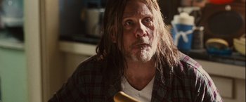 Movie still from “Halloween” (2007), directed by Rob Zombie – A person with long hair; Close Up shot, Low angle