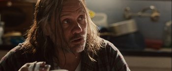 Movie still from “Halloween” (2007), directed by Rob Zombie – A person with long hair; Close Up shot, Over the shoulder angle