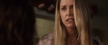 Movie still from “Halloween” (2007), directed by Rob Zombie – A person with long blonde hair; Close Up shot, Over the shoulder angle