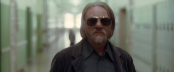 Movie still from “Halloween” (2007), directed by Rob Zombie – A person wearing sunglasses and a jacket; Close Up shot, Low angle