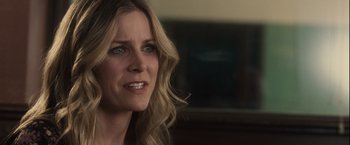 Movie still from “Halloween” (2007), directed by Rob Zombie – A person with long blonde hair; Close Up shot, Over the shoulder angle