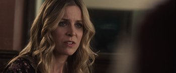 Movie still from “Halloween” (2007), directed by Rob Zombie – A person with long blonde hair; Close Up shot, Over the shoulder angle