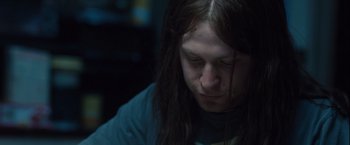 Movie still from “Halloween” (2007), directed by Rob Zombie – A man with long hair is looking down at his face; Close Up shot, Low angle