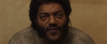 Movie still from “Halloween” (2007), directed by Rob Zombie – A person with a beard; Close Up shot, Low angle